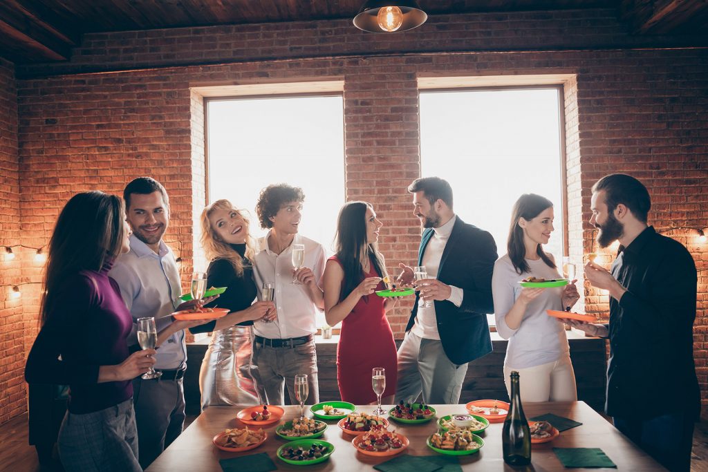 Four single men and women sharing a dinner together.