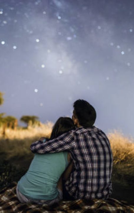 Couple on date stargazing.