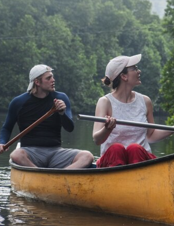 boyfriend and girlfriend kayaking on the lake together. dating.