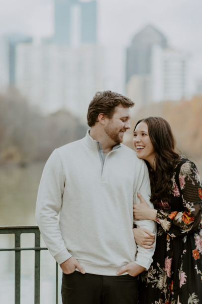 Man and woman gazing at each other lovingly at Piedmont Park.